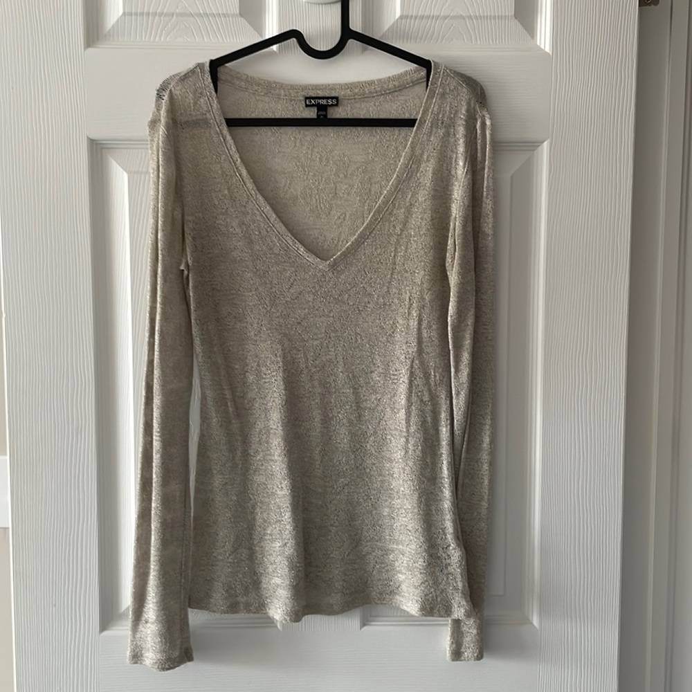 Pretty deep V sheer knit top.